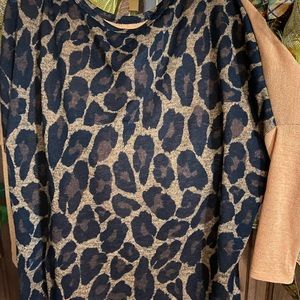 Women shirt mustard color with leopard pocket and back. Brand new.